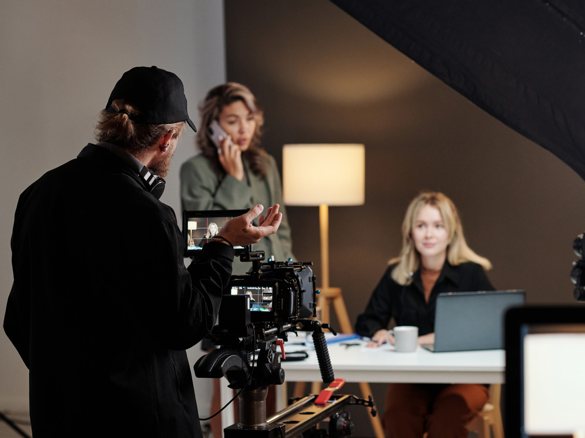 Professional video production crew filming a branded training series
