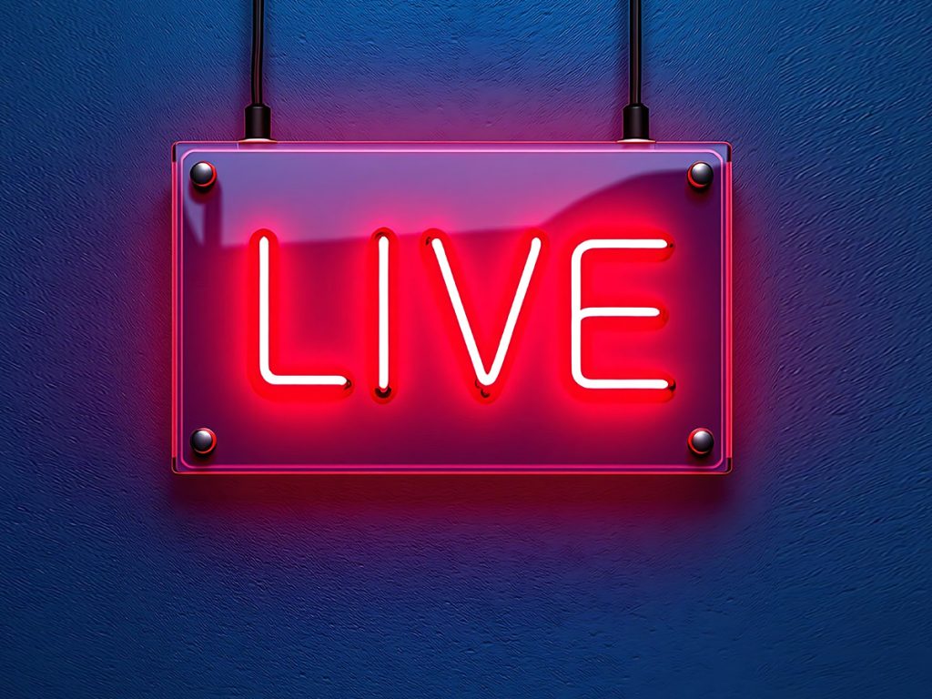 Live event streaming production crew managing multi-camera broadcast at a large-scale conference