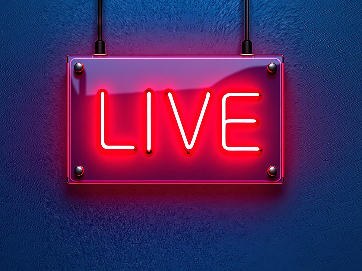 Live event streaming production crew managing multi-camera broadcast at a large-scale conference