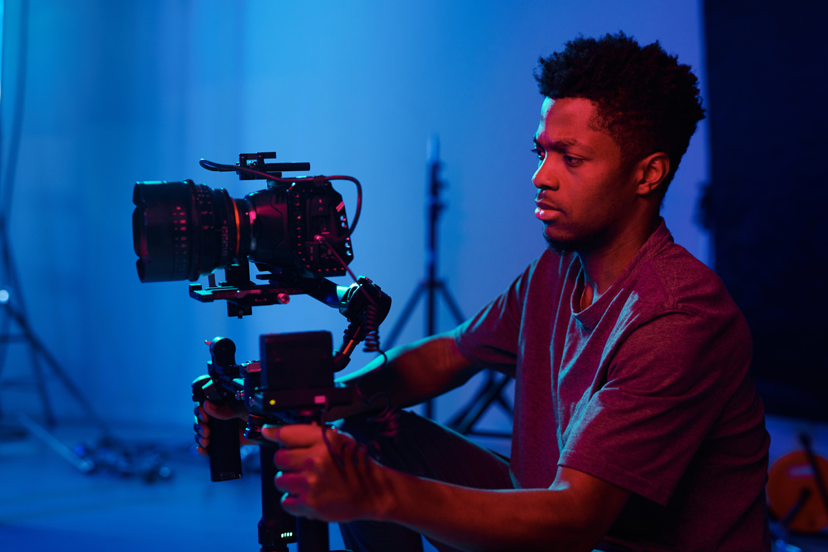Camera operator running a broadcast camera setup for a live streaming production